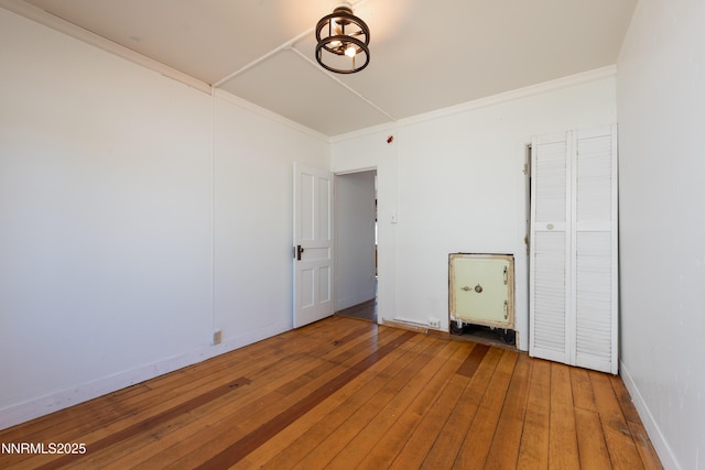 1417 Douglas Ave, Gardnerville, NV 89410 - empty room featuring wood-type flooring, ornamental molding, and baseboards