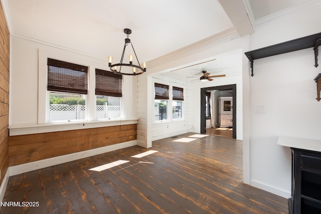 1417 Douglas Ave, Gardnerville, NV 89410 - unfurnished dining area featuring wood finished floors, plenty of natural light, a chandelier, baseboards, and wooden walls