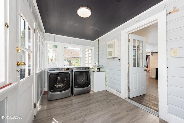 1417 Douglas Ave, Gardnerville, NV 89410 - laundry room featuring washing machine and clothes dryer, wood finished floors, wooden ceiling, and wooden walls