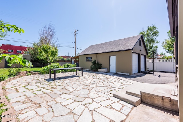 1417 Douglas Ave, Gardnerville, NV 89410 - view of patio / terrace with an outbuilding and a garage