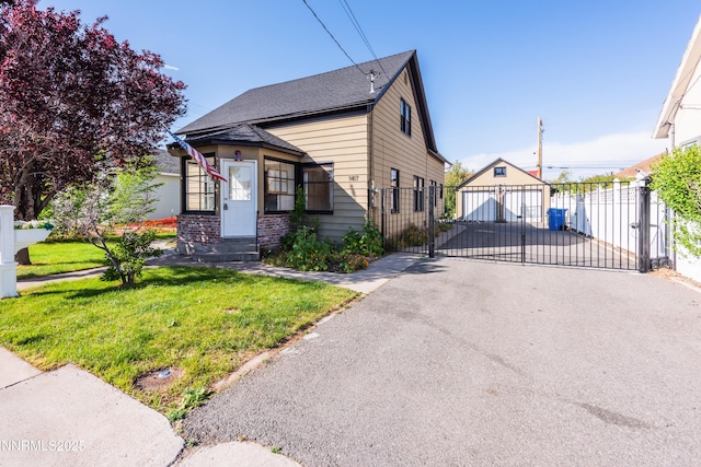 1417 Douglas Ave, Gardnerville, NV 89410 - view of front of property featuring a gate, an outbuilding, and a shingled roof