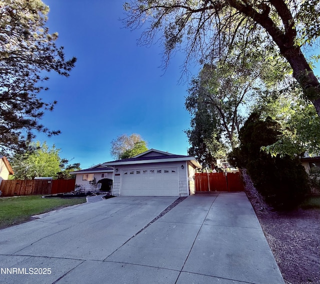 3100 Pine Ln, Carson City, NV 89706 - view of side of property with an attached garage and concrete driveway