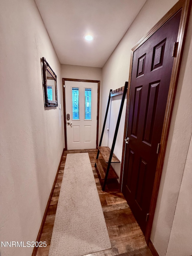 3100 Pine Ln, Carson City, NV 89706 - doorway featuring dark wood-type flooring and baseboards