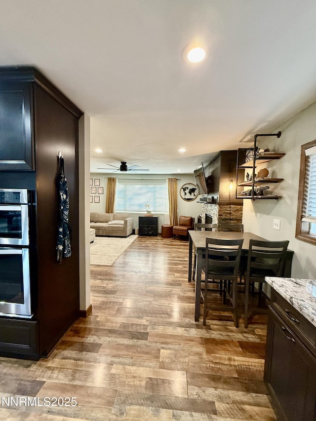 3100 Pine Ln, Carson City, NV 89706 - dining room with light wood-type flooring, a ceiling fan, and recessed lighting