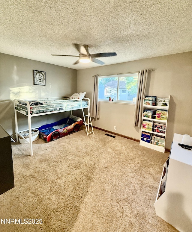 3100 Pine Ln, Carson City, NV 89706 - carpeted bedroom featuring a ceiling fan, baseboards, and a textured ceiling