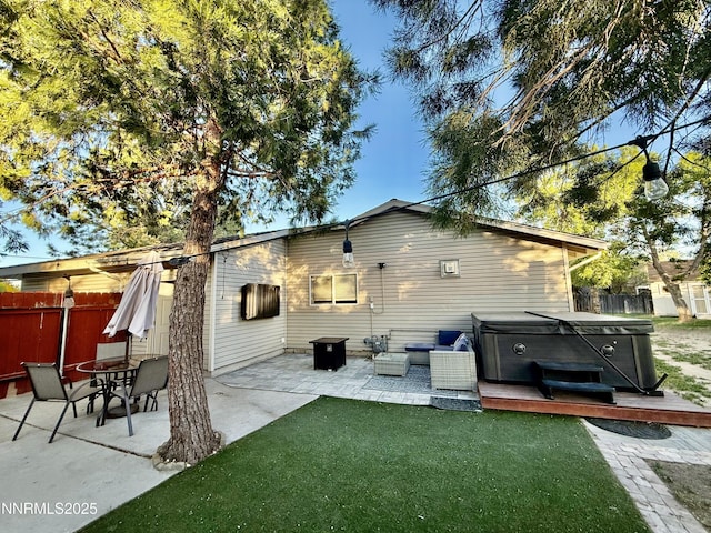 3100 Pine Ln, Carson City, NV 89706 - back of house featuring a hot tub, a patio area, and a wooden deck