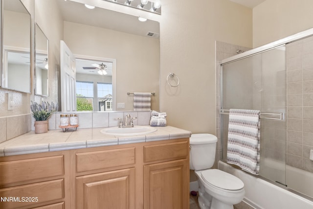 6638 Aston Cir, Sparks, NV 89436 - bathroom featuring vanity, toilet, enclosed tub / shower combo, and a ceiling fan