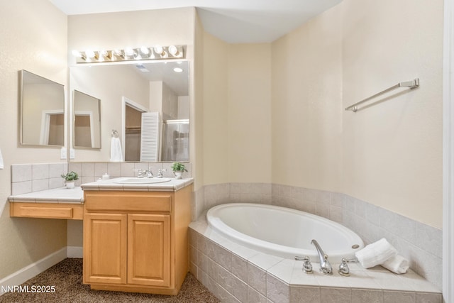 6638 Aston Cir, Sparks, NV 89436 - bathroom featuring vanity, a garden tub, and an enclosed shower