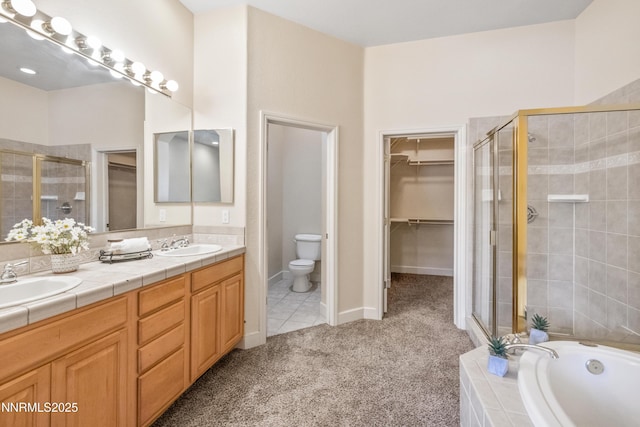 6638 Aston Cir, Sparks, NV 89436 - full bathroom with a shower stall, double vanity, a garden tub, toilet, and a walk in closet