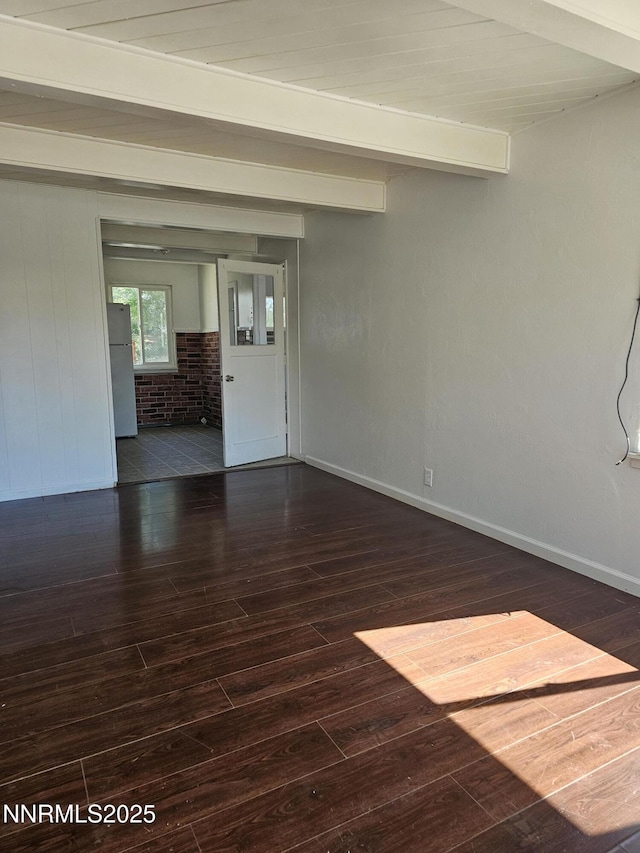 121 English St, Hawthorne, NV 89415 - spare room featuring wood finished floors, beam ceiling, and baseboards