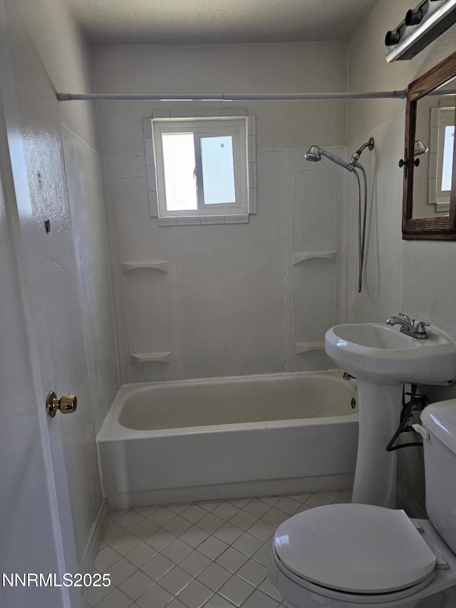 121 English St, Hawthorne, NV 89415 - bathroom with toilet, tile patterned floors, and washtub / shower combination