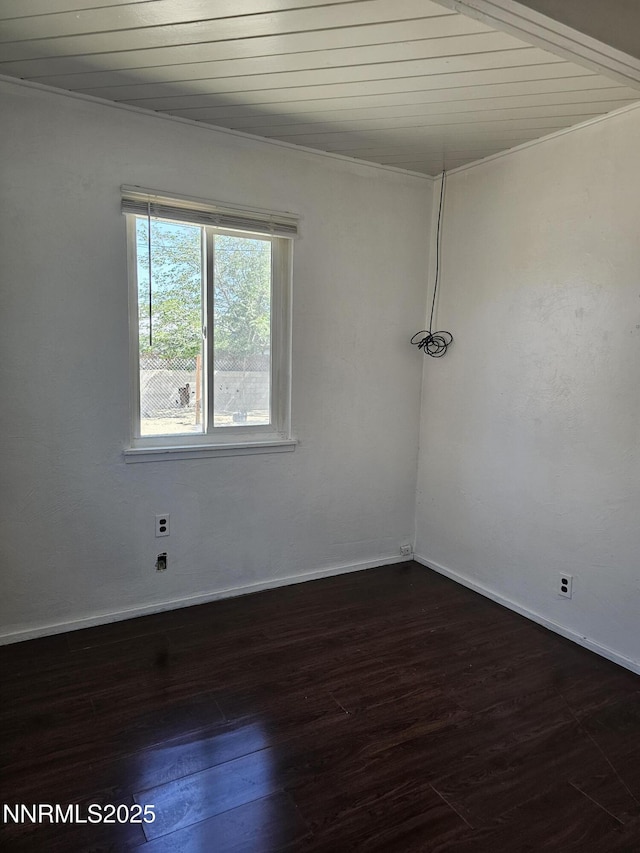 121 English St, Hawthorne, NV 89415 - unfurnished room with dark wood finished floors, baseboards, and wood ceiling