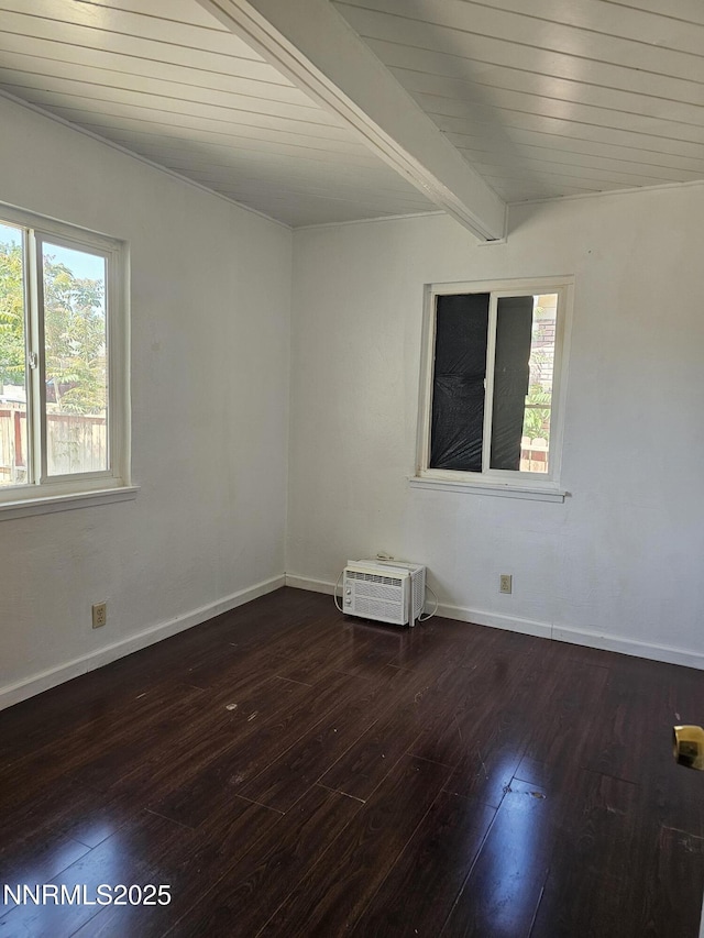 121 English St, Hawthorne, NV 89415 - unfurnished room with hardwood / wood-style flooring, baseboards, a wall unit AC, and wooden ceiling with exposed beams