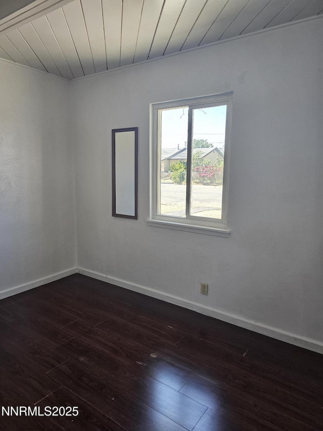 121 English St, Hawthorne, NV 89415 - unfurnished room with dark wood-style flooring, baseboards, and wooden ceiling