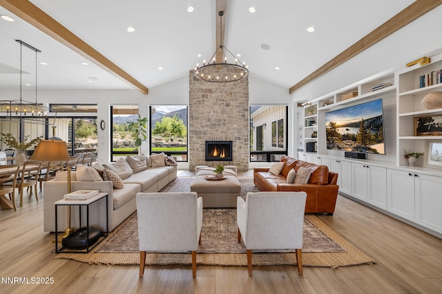 6300 Trailblazer Ct, Reno, NV 89511 - living room with a chandelier, beam ceiling, light wood-style flooring, a fireplace, and high vaulted ceiling