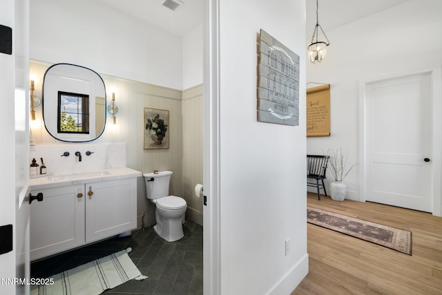 6300 Trailblazer Ct, Reno, NV 89511 - bathroom featuring vanity, toilet, and wood finished floors