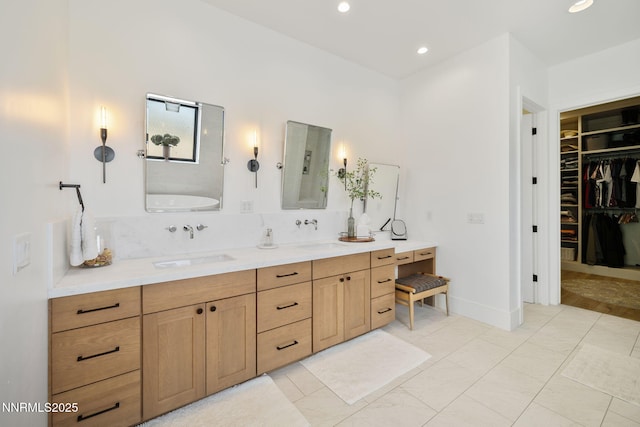 6300 Trailblazer Ct, Reno, NV 89511 - bathroom featuring double vanity, a spacious closet, and recessed lighting