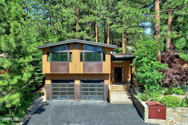 259 Mc Faul Ct, Zephyr Cove, NV 89448 - modern home with asphalt driveway and an attached garage