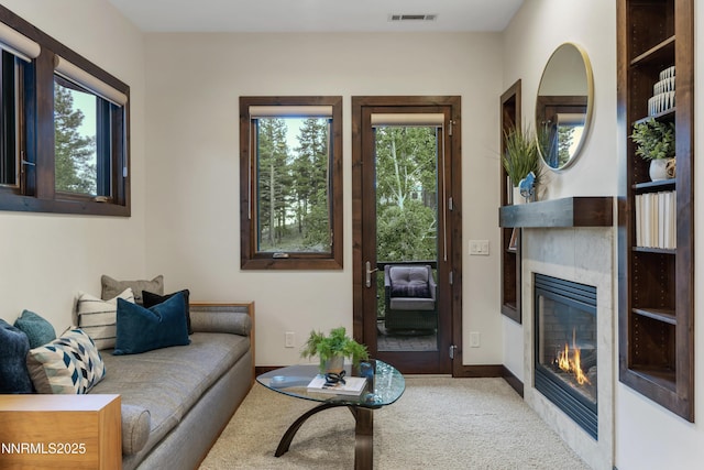 235 Timbercreek Ct, Reno, NV 89511 - carpeted living area featuring a tiled fireplace and baseboards