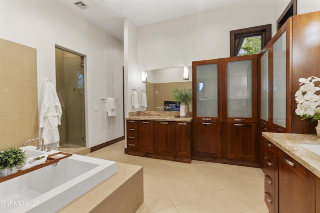 235 Timbercreek Ct, Reno, NV 89511 - full bath with vanity, a shower stall, tiled bath, and tile patterned flooring
