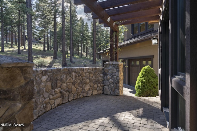 235 Timbercreek Ct, Reno, NV 89511 - view of patio featuring a pergola and a garage
