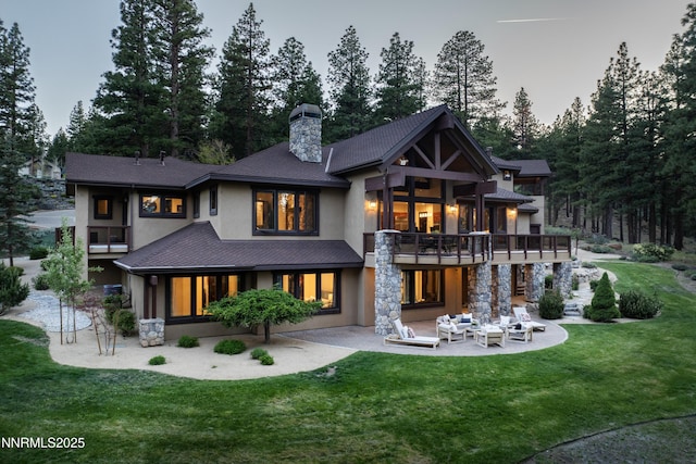 235 Timbercreek Ct, Reno, NV 89511 - rear view of property featuring a balcony, a patio area, a chimney, and a lawn