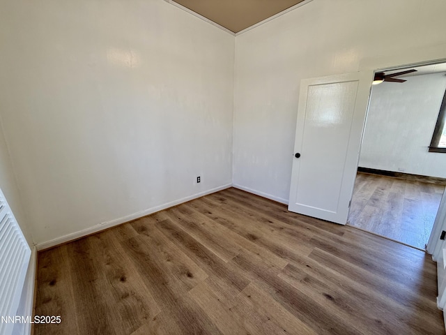 141 University St, Tonopah, NV 89049 - unfurnished bedroom featuring wood finished floors and baseboards