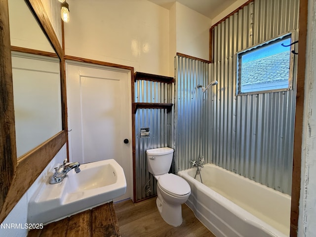 141 University St, Tonopah, NV 89049 - full bathroom with toilet, wood finished floors, and bathtub / shower combination
