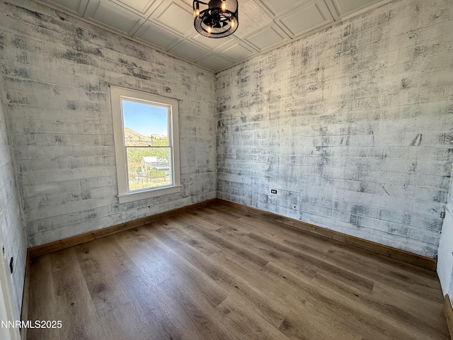 141 University St, Tonopah, NV 89049 - unfurnished room featuring baseboards, an ornate ceiling, and wood finished floors