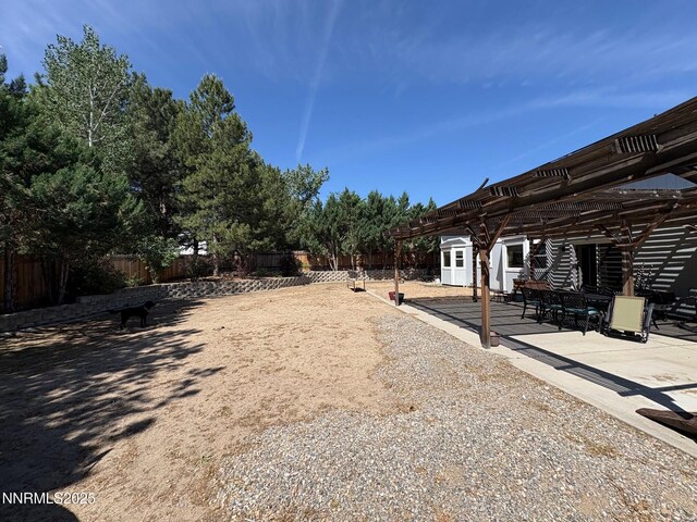 1885 Yale Dr, Carson City, NV 89703 - fenced backyard with a pergola and a patio area