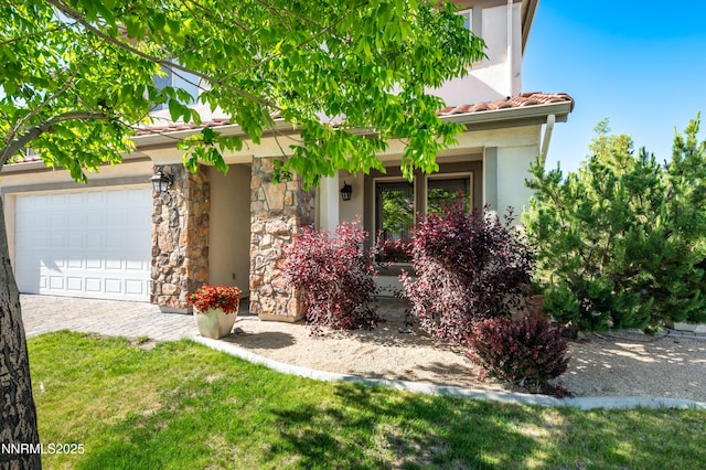 471 Shire Ct, Reno, NV 89521 - view of front of home with a garage, stone siding, stucco siding, a tile roof, and driveway