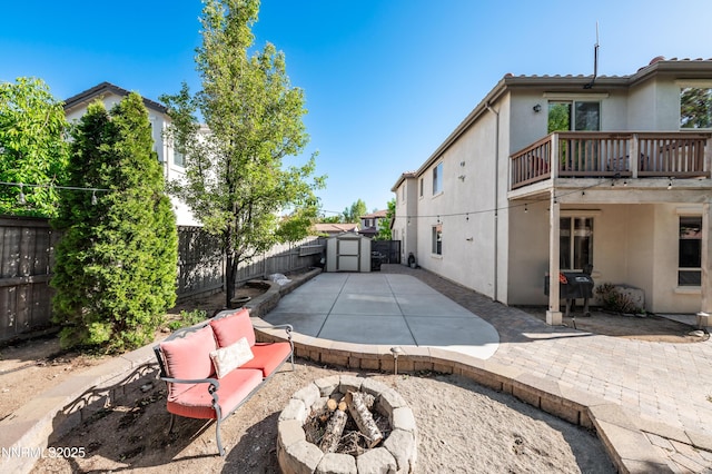 471 Shire Ct, Reno, NV 89521 - fenced backyard with an outdoor fire pit and a patio