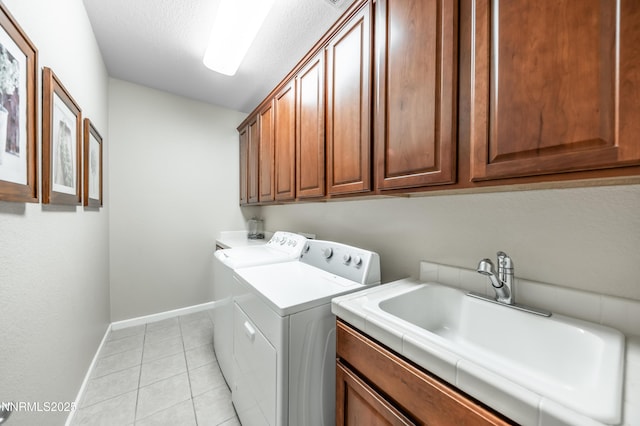 471 Shire Ct, Reno, NV 89521 - laundry room featuring washer and clothes dryer, cabinet space, baseboards, light tile patterned floors, and a textured ceiling