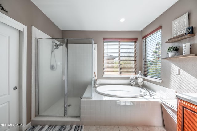 471 Shire Ct, Reno, NV 89521 - bathroom featuring a bath, a stall shower, vanity, and tile patterned floors