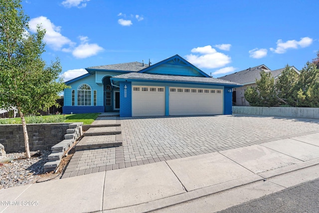 6649 Valley Wood Dr, Reno, NV 89523 - ranch-style house with an attached garage, decorative driveway, and brick siding