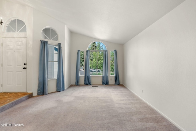 6649 Valley Wood Dr, Reno, NV 89523 - carpeted empty room featuring lofted ceiling and baseboards