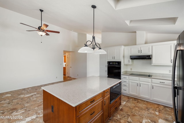 6649 Valley Wood Dr, Reno, NV 89523 - kitchen with black appliances, under cabinet range hood, ceiling fan, white cabinetry, and a center island
