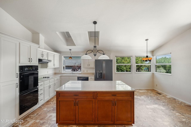 6649 Valley Wood Dr, Reno, NV 89523 - kitchen with black appliances, lofted ceiling, a sink, white cabinetry, and pendant lighting