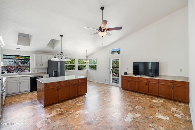 6649 Valley Wood Dr, Reno, NV 89523 - kitchen with black dishwasher, fridge with ice dispenser, a sink, light countertops, and ceiling fan