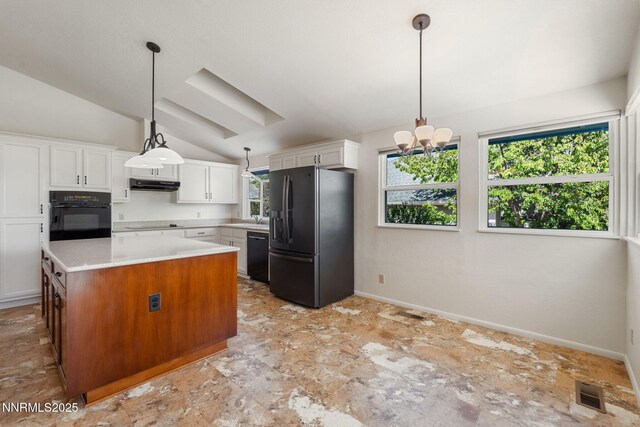6649 Valley Wood Dr, Reno, NV 89523 - kitchen featuring black appliances, vaulted ceiling, under cabinet range hood, light countertops, and white cabinetry