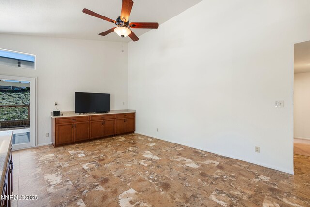 6649 Valley Wood Dr, Reno, NV 89523 - unfurnished living room with ceiling fan and baseboards