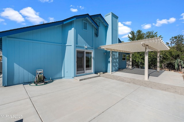 6649 Valley Wood Dr, Reno, NV 89523 - rear view of property featuring a pergola and a patio area