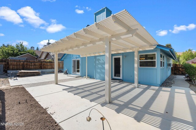6649 Valley Wood Dr, Reno, NV 89523 - back of house featuring a pergola and a patio