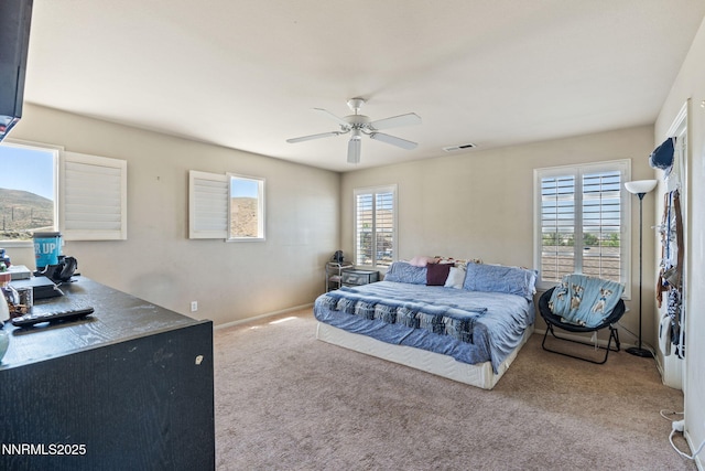 7991 Mariner Cove Dr, Reno, NV 89506 - carpeted bedroom featuring baseboards and a ceiling fan