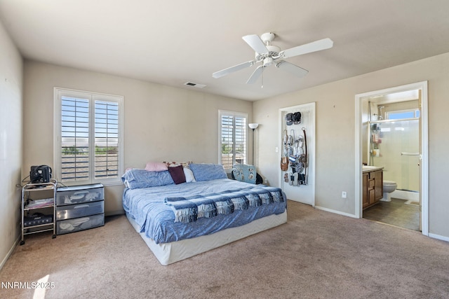 7991 Mariner Cove Dr, Reno, NV 89506 - carpeted bedroom featuring ensuite bathroom and ceiling fan