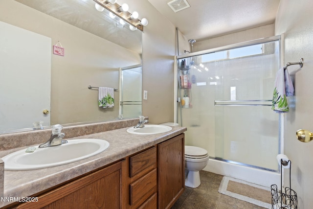 7991 Mariner Cove Dr, Reno, NV 89506 - bathroom featuring a shower stall, double vanity, and tile patterned flooring
