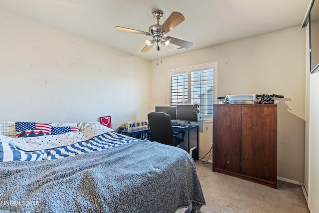 7991 Mariner Cove Dr, Reno, NV 89506 - carpeted bedroom with ceiling fan and a desk