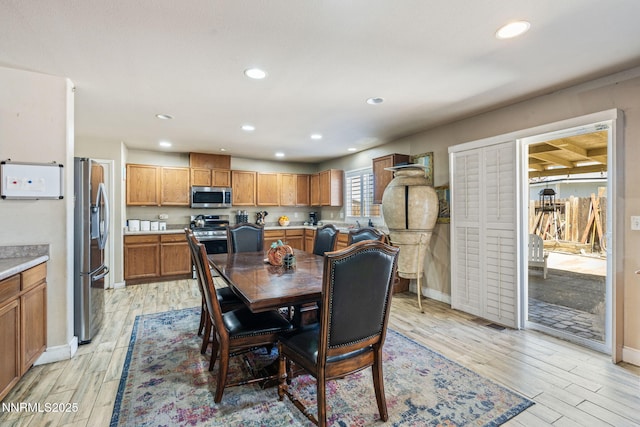 7991 Mariner Cove Dr, Reno, NV 89506 - dining area featuring light wood-style floors and recessed lighting