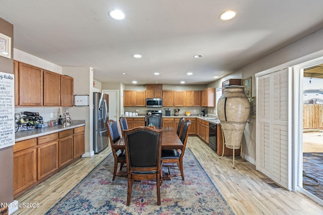 7991 Mariner Cove Dr, Reno, NV 89506 - dining area with light wood-style floors and recessed lighting