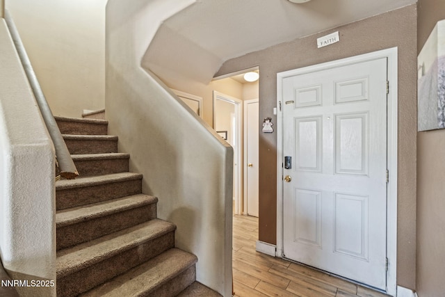 7991 Mariner Cove Dr, Reno, NV 89506 - foyer entrance with light wood-type flooring and stairs